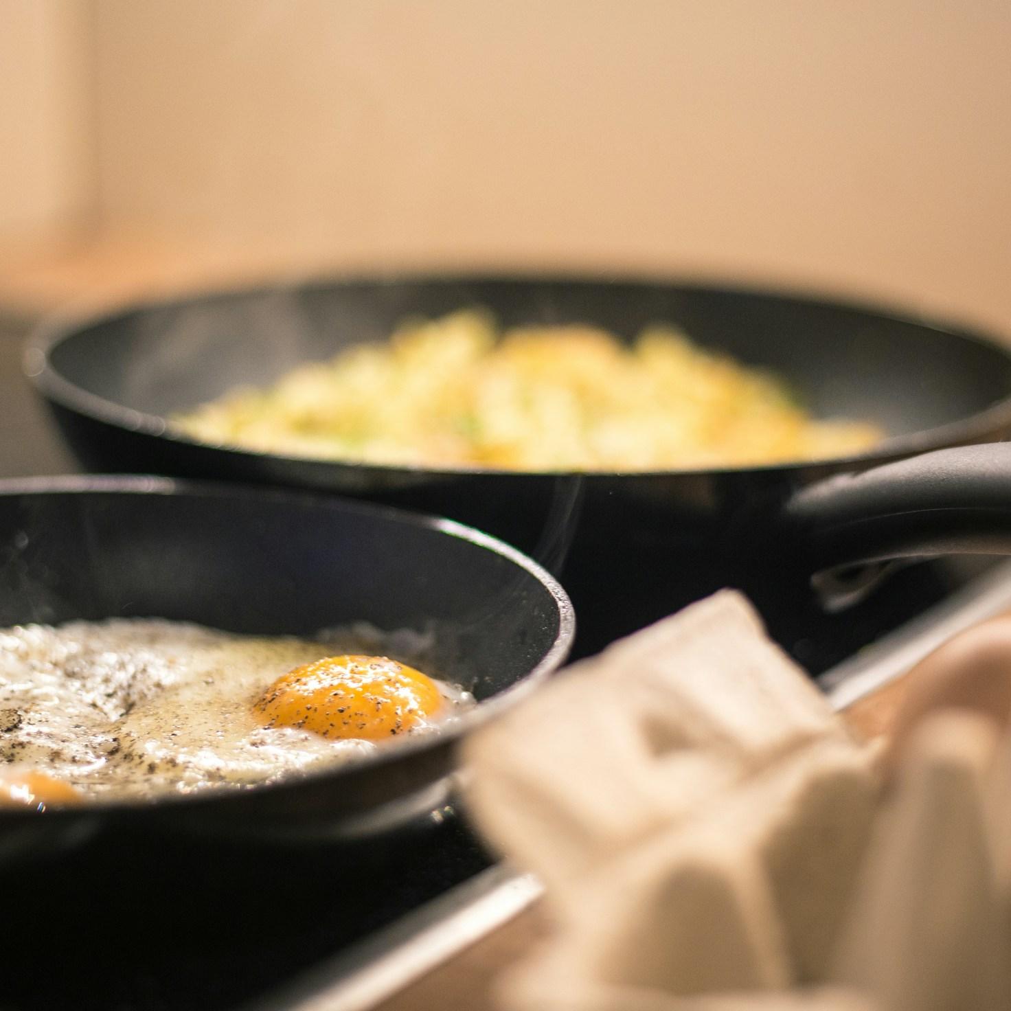 Community members collaborating in a contemporary kitchen, sharing recipes and culinary techniques